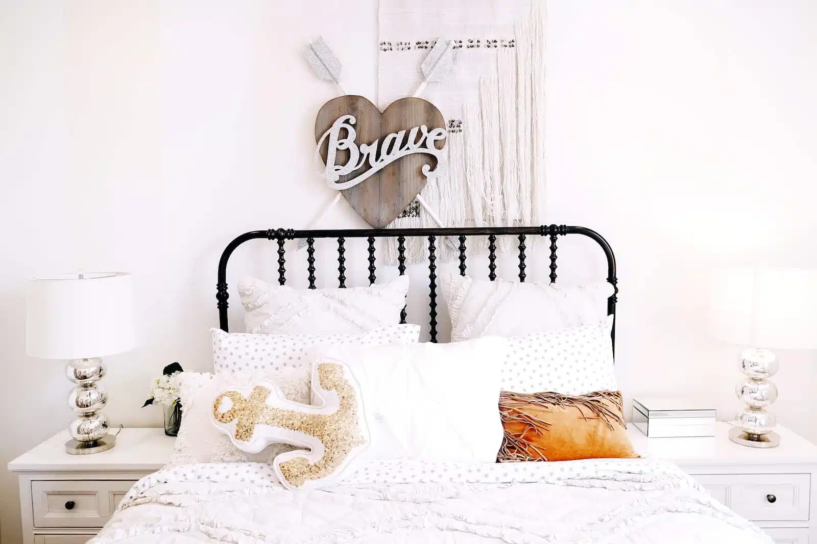 pillows on bed beside headboard